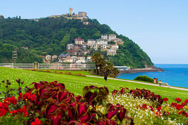 San Sebastian, Spain - Jun 18, 2025: View of Monte Igueldo from Miramar palace garden in San Sebastian, Spain