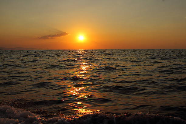 Golden hours on ocean coast, sunset on the sea, idyllic background
