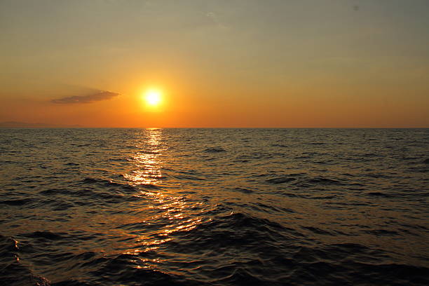 Golden hours on ocean coast, sunset on the sea, idyllic background