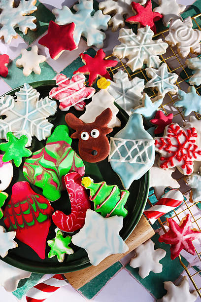 istock Image of mixed christmas cookies with colorful baubles, royal icing patterns featuring snowflakes and stars, surrounded by festive decorations 2247702093