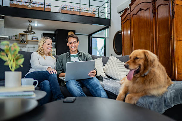 istock Couple talking and using laptop at home 2247704140