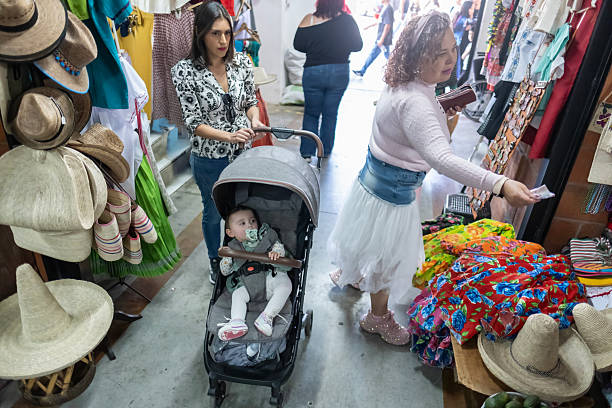 baby sitting in his stroller at a craft market