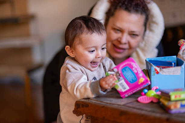 istock mother caring for her baby while he plays 2247707692