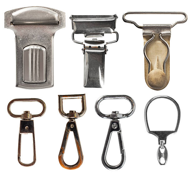 Isolated photo of various style metal cloth or chain spring hooks and holders on white background.