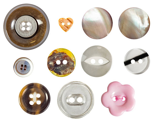 istock Isolated photo of various colored and shaped plastic cloth buttons on white background. 2247710315