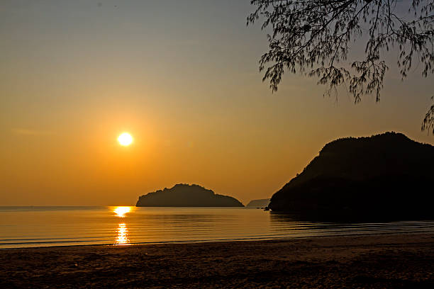 Sunrise and silhouette in morning at Ao Manao beach, Prachuap Khiri Khan Province in Thailand.