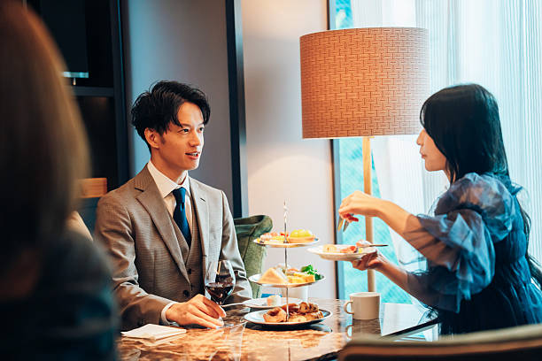 istock A man enjoying afternoon tea with a young woman 2247714626