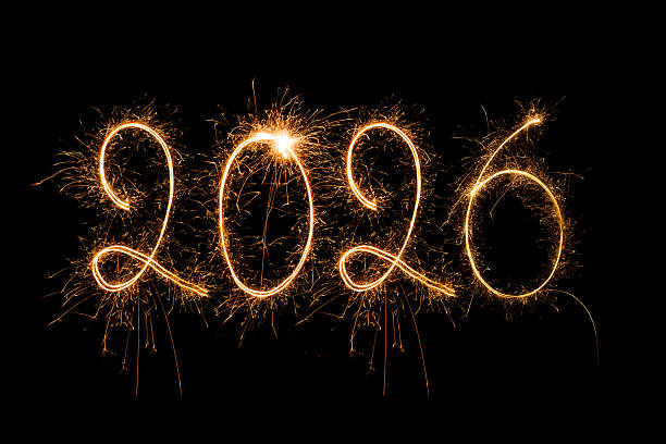 istock Burning sparkling text 2026 isolated on black background.Happy New Year 2026. 2247716428