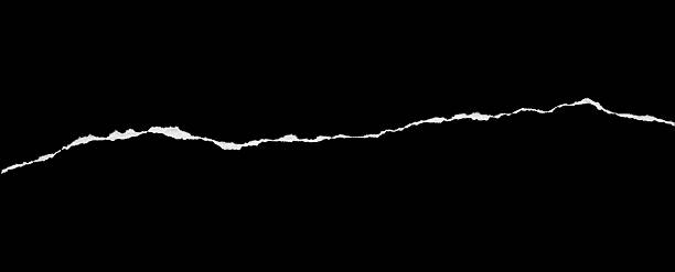 istock Ripped torn paper edges isolated on black background 2247718563
