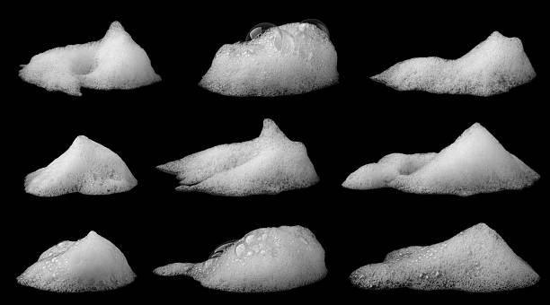 istock collection liquid white foam soap, shampoo, or shower gel. Abstract bubbles. isolated on black background. Clean concept, cosmetic visuals for a suds product. realistic soap texture with detailed bubble 2247719977