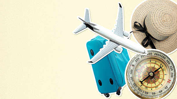 istock Airplane, a suitcase, a straw hat, and a compass on a cream background. Copy space. Concept of travel and adventure 2247721792