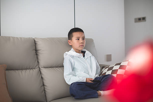 istock Bored child on living room. 2247723853