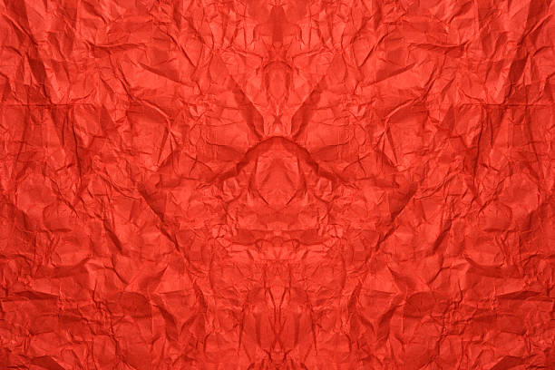 istock Crumpled red paper abstract background 2247725928