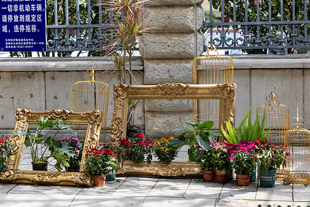 Street View in Kunming. Flowers  and frame on the street.