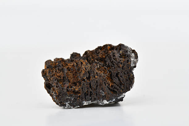 istock Rough Axinite Mineral Cluster with White Crystalline Inclusions 2247729216