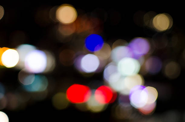 istock Abstract colorful bokeh orbs on dark background, vibrant defocused light dots pattern, festive overlay texture for photo editing, blurred bright circular shapes for design backdrop 2247730511