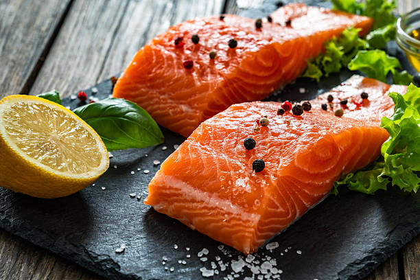 istock Fresh raw salmon steaks on stone cutting board 2247731555