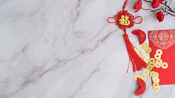 istock Chinese New Year decorations with gold coins and red envelopes 2247736910