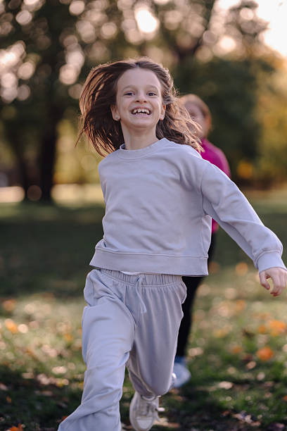 istock Happy child running in park feeling joy and freedom 2247739023