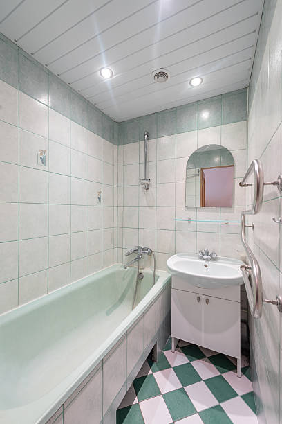 istock Modern Bathroom Interior With Bathtub and Tiled Walls in Light Colors 2247741723