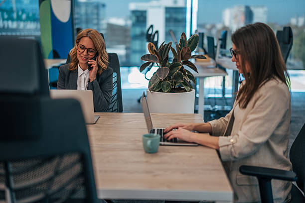 istock Businesswomen working in modern open plan office 2247742485