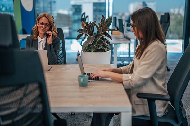 istock Businesswomen working in modern office making phone calls 2247742529
