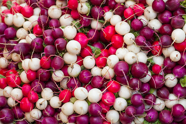 Colorful radishes (Raphanus sativus) at a market stall, Germany