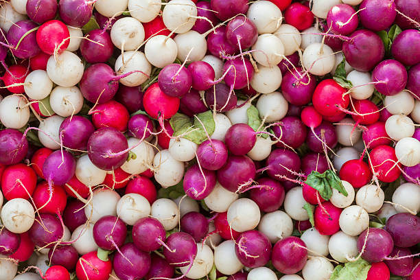 Colorful radishes (Raphanus sativus) at a market stall, Germany