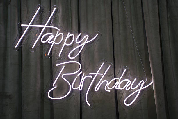 istock Bright birthday celebration sign lights up the room 2247744618