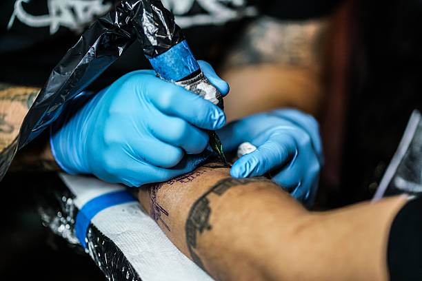 istock Making tattoo in the tattoo studio. 2247747220