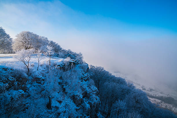 Wintery view from the flatness near Waltersdorf to the snowy fortress Königstein in Saxon Switzerland.