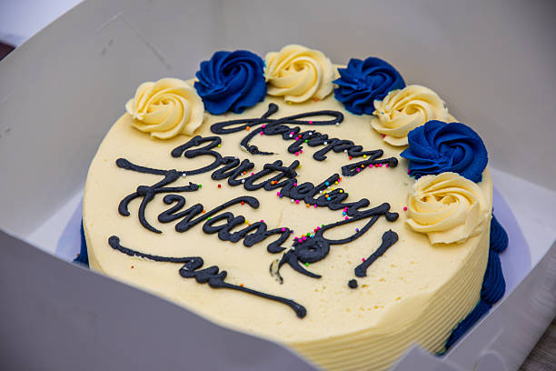 istock Birthday Cake with Blue and Yellow Frosting Roses 2247751081