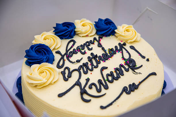 istock Birthday Cake with Blue and Yellow Frosting Roses 2247751086