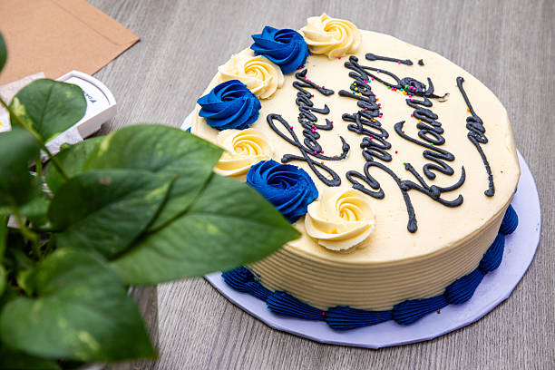 istock Birthday Cake with Blue and Yellow Frosting Roses 2247751117