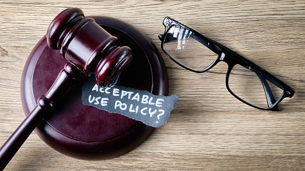 istock Acceptable Use Policy question on a gavel with reading glasses, symbolizing legal review, compliance, and corporate governance. 2247753342