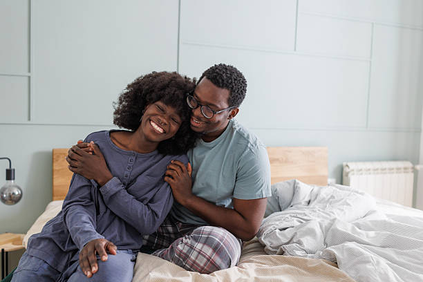 istock Couple embracing on the bed in a cozy bedroom 2247754086
