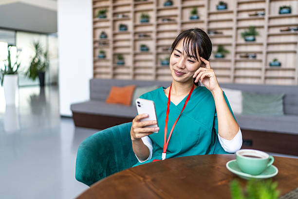 istock Healthcare worker using phone on coffee break 2247757015