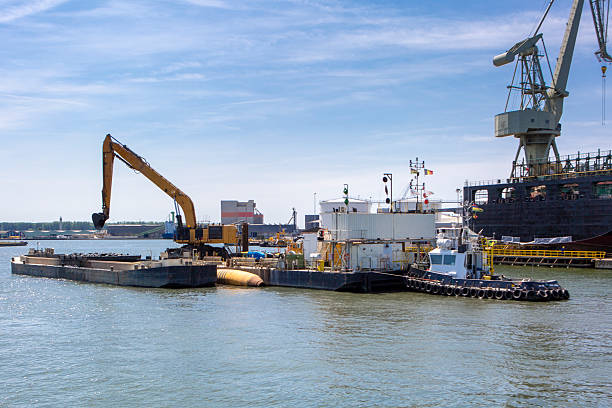 Port of Antwerp - barge and construction site on River Scheldt