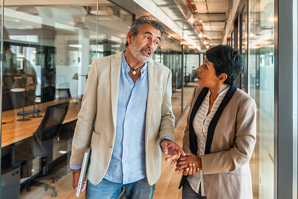 istock Business colleagues walking and discussing work in office 2247758839