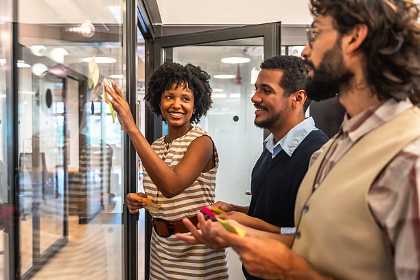 istock Diverse business team brainstorming ideas on glass wall 2247758892