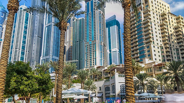 istock Fountain and palms timelapse at the Marina walk during day time. Dubai, UAE 2247759034
