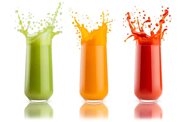 istock Fresh colorful vegetable juices different colors  with flying drops, splashes in glasses isolated on white background. Set of three glasses. Carrot juice, tomato juice, celery juice. Healthy drink. 2247759258