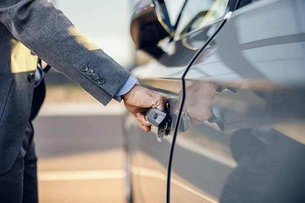 istock Businessman opening car door getting to work 2247760264