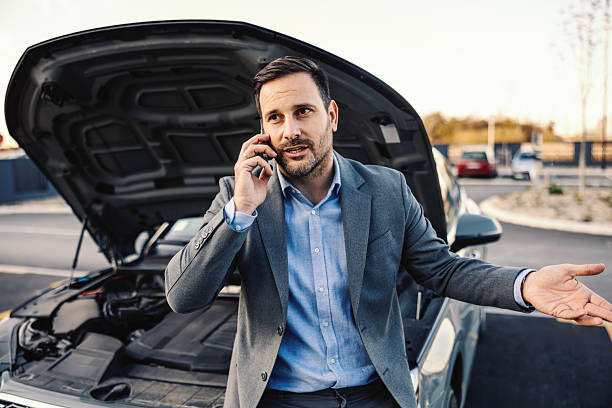 istock Man calling for roadside assistance after car breakdown 2247760861