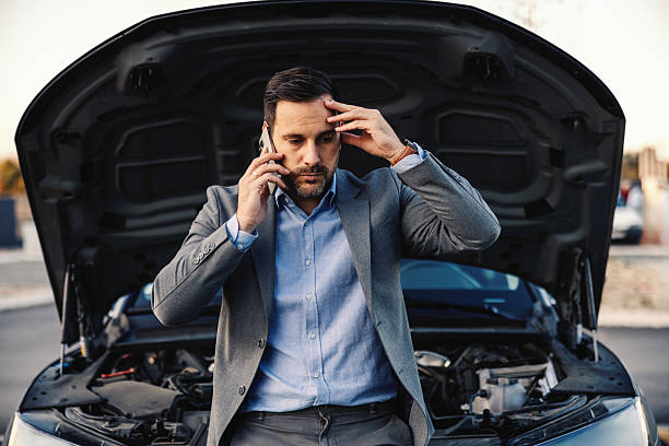 istock Businessman calling for roadside assistance after car breakdown 2247760865