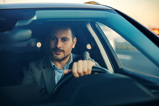 istock Businessman driving car navigating daily city commute 2247760992
