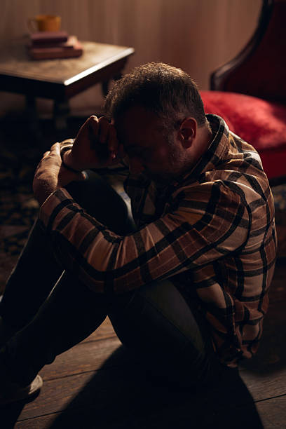 istock Man with depression and headache at home. 2247765062