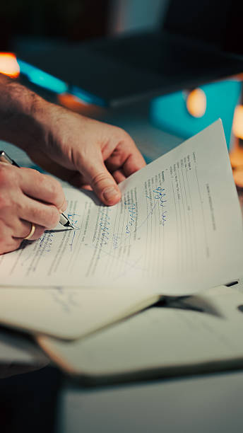 istock Hands Signing Car Sale Agreement Document 2247766411