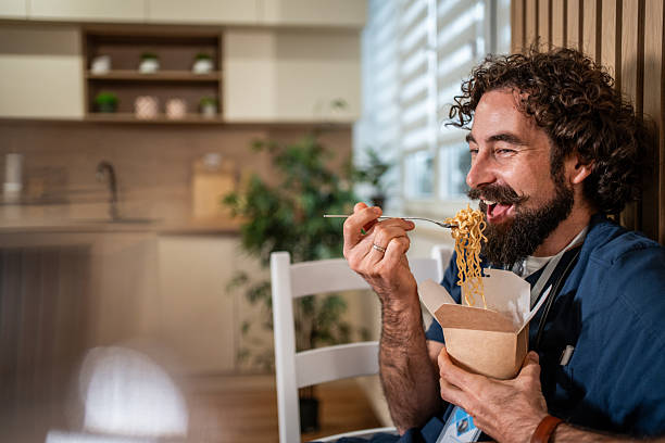 istock Healthcare worker eating lunch during break 2247774114
