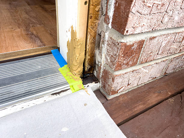 istock Applying Wood Filler to Door Frame Corner 2247777540